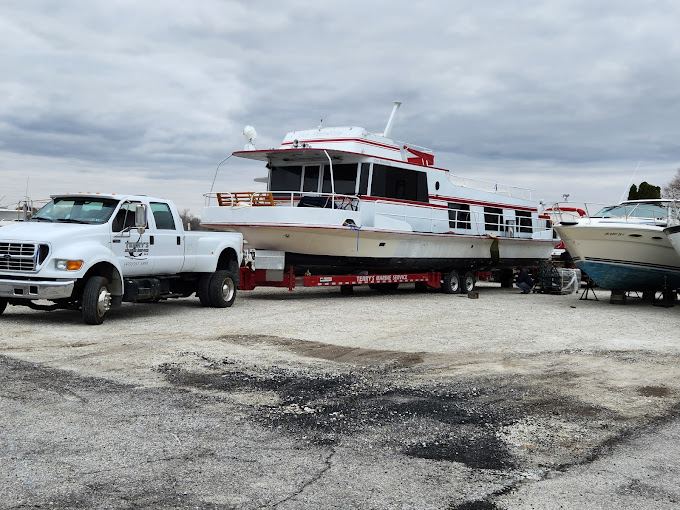 SeaArk boat with Suzuki outboard inside service facility