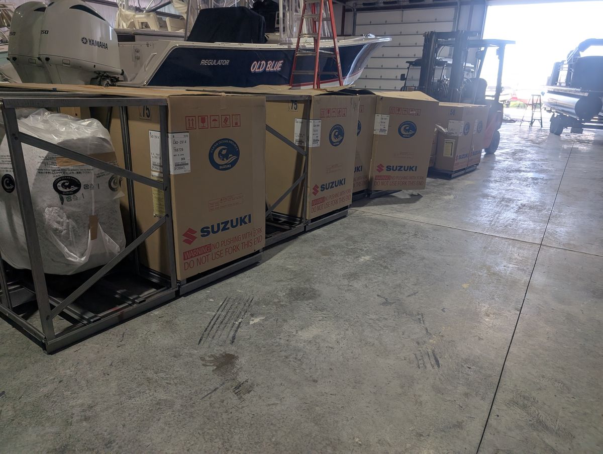 New Suzuki outboard motors in crates at Terry's Marine
